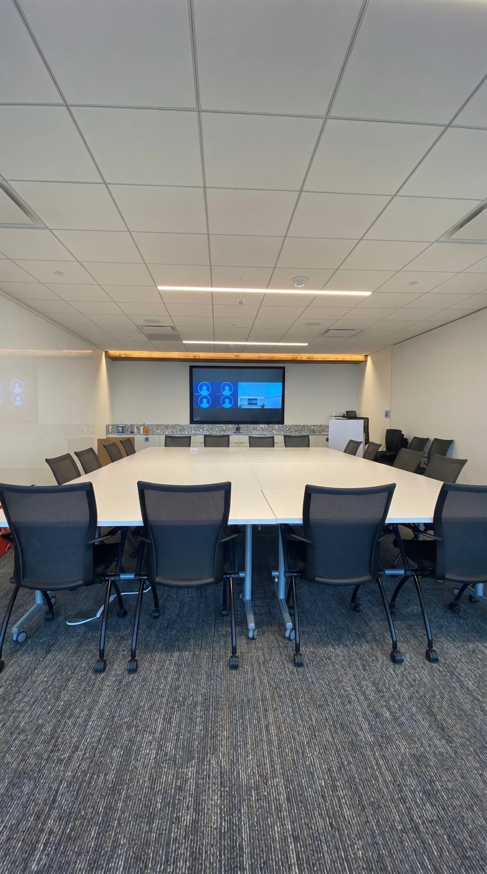 Boardroom AV setup around a large conference table