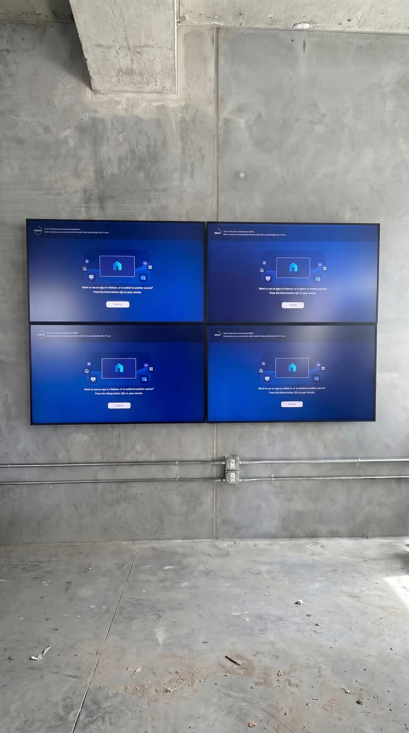 Large-venue 2x2 video wall on a concrete wall for company town halls