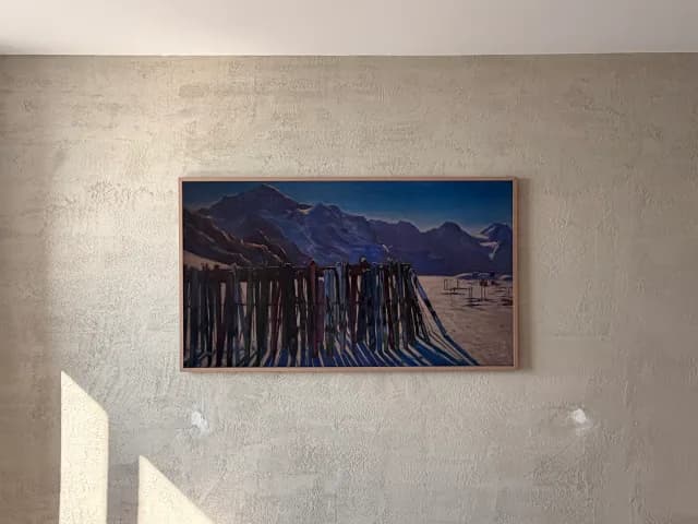 Frame TV with mountain ski-lodge artwork,