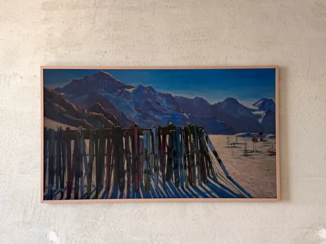 Frame TV with mountain ski-lodge artwork,