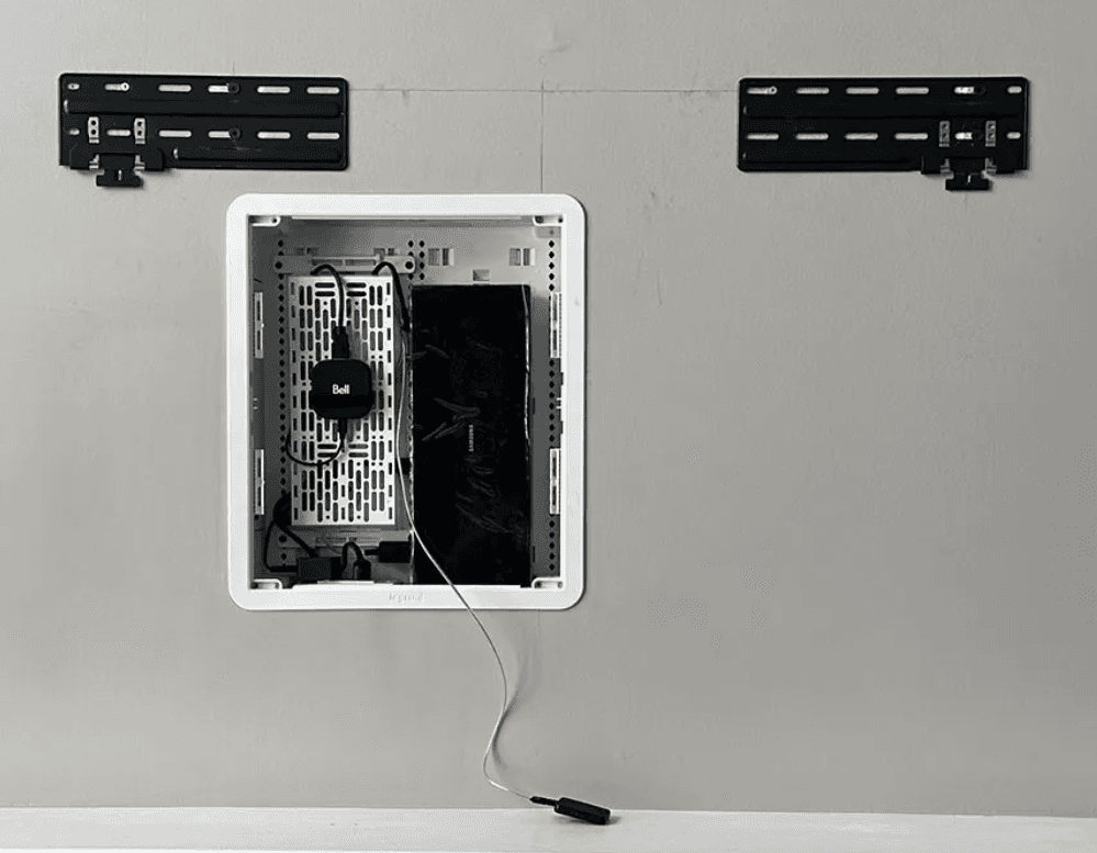 In-wall recessed box installation between two wall mount brackets before the Samsung Frame TV is hung